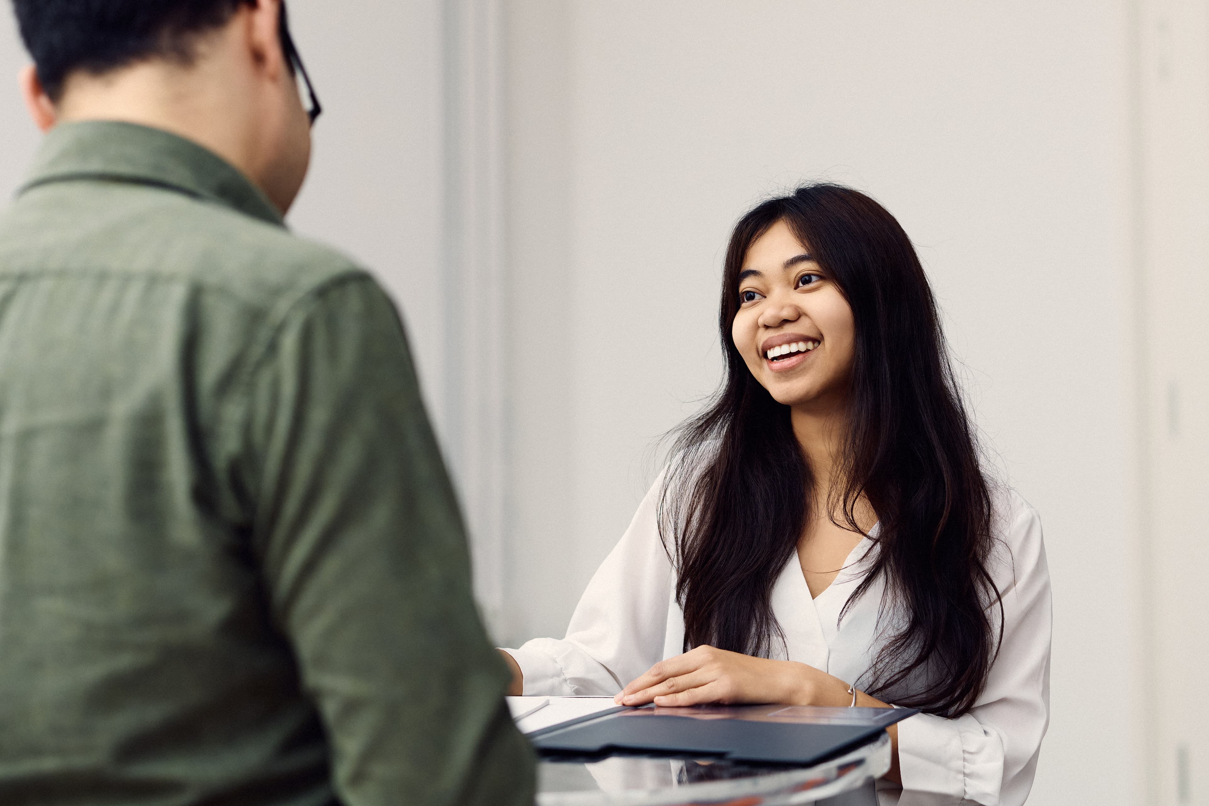 Two IWM employees talking to each other