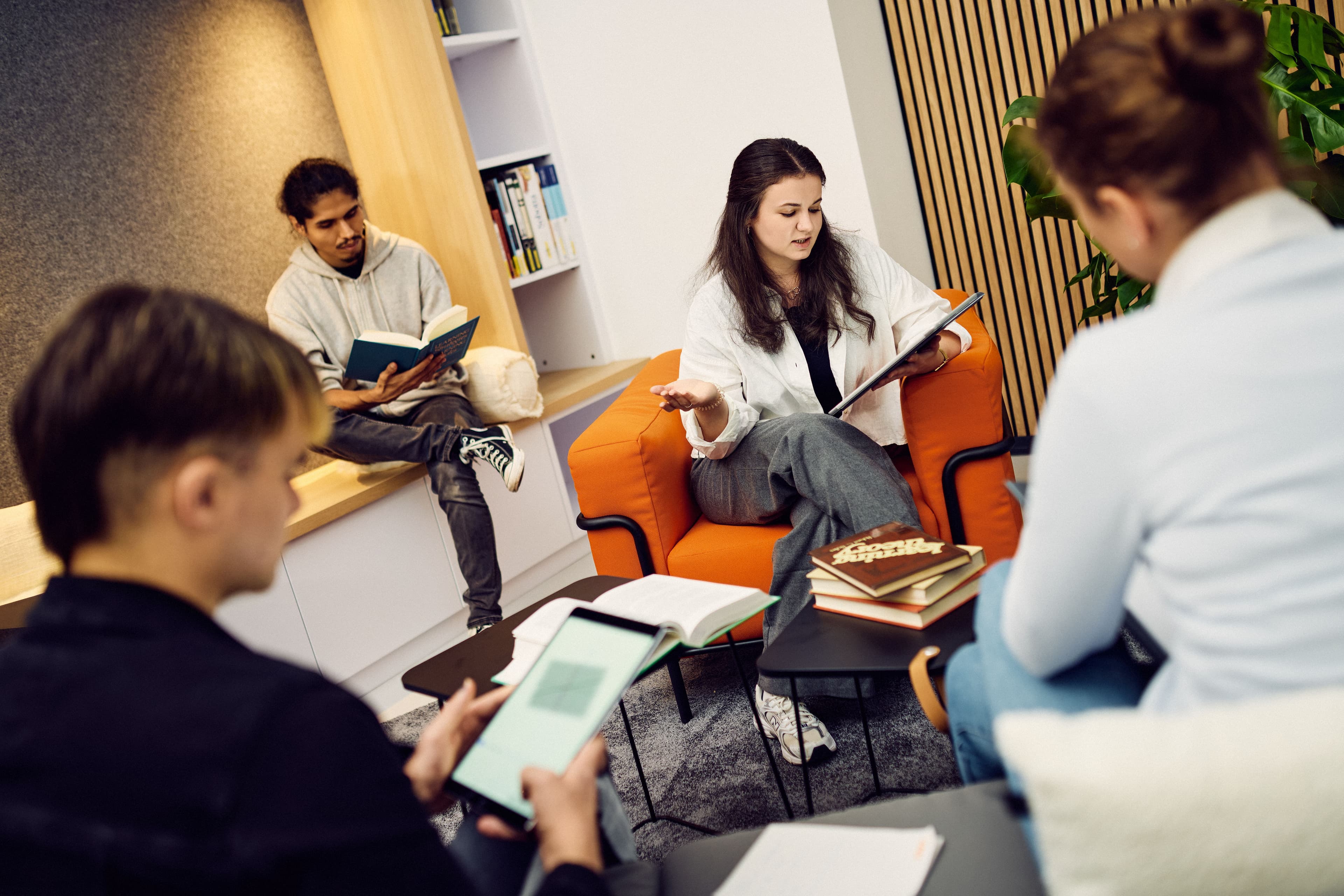 Four IWM employees working in the library