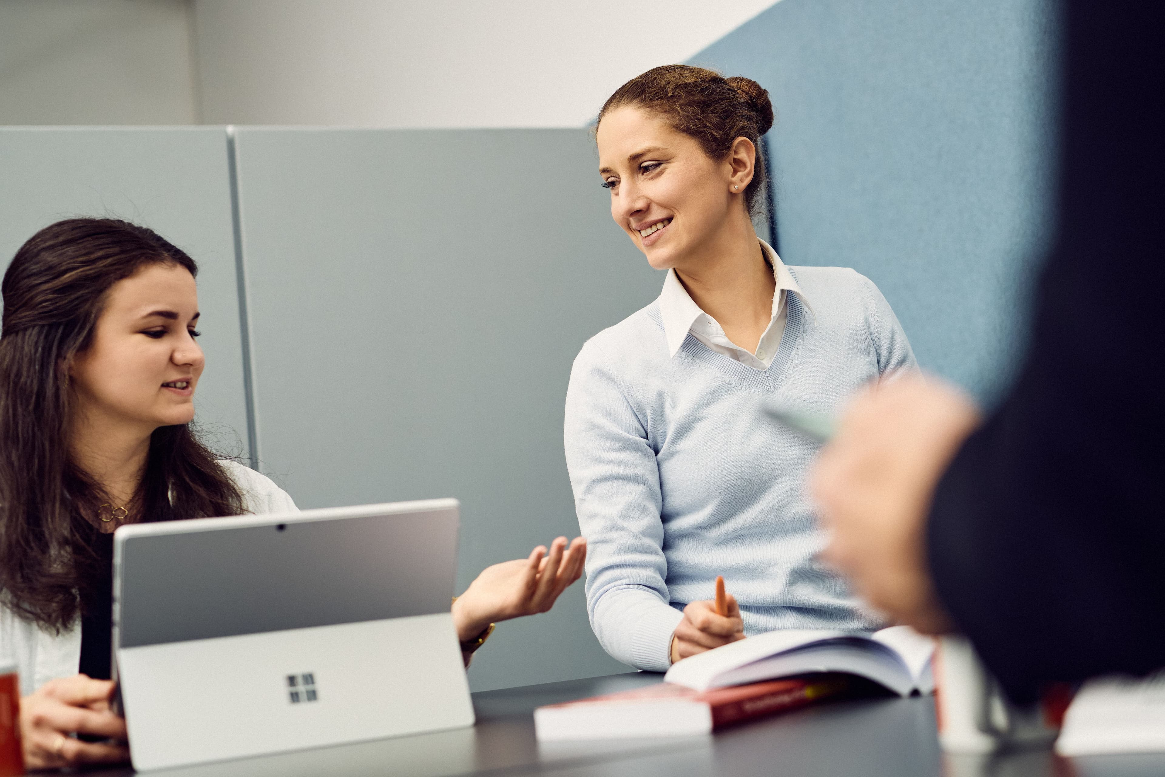Two IWM employees working together and exchanging ideas